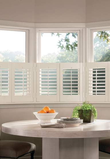 Room with bay windows and cafe style shutters in Suffolk